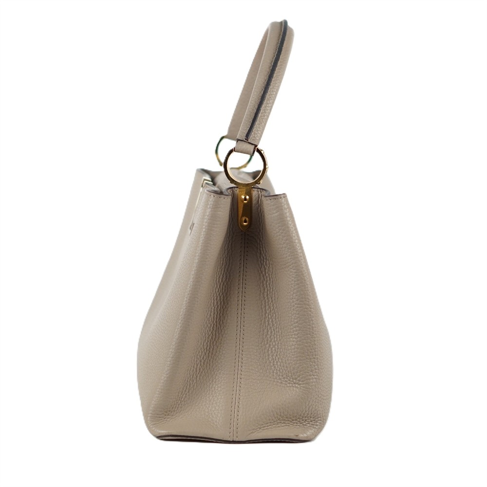 HANDTASCHE - LOUIS VUITTON CAPUCINES MM TAURILLON LEDER GALET