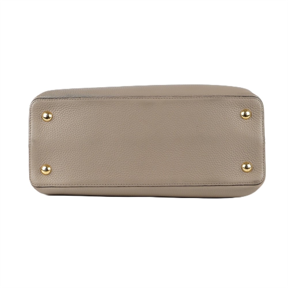 HANDTASCHE - LOUIS VUITTON CAPUCINES MM TAURILLON LEDER GALET